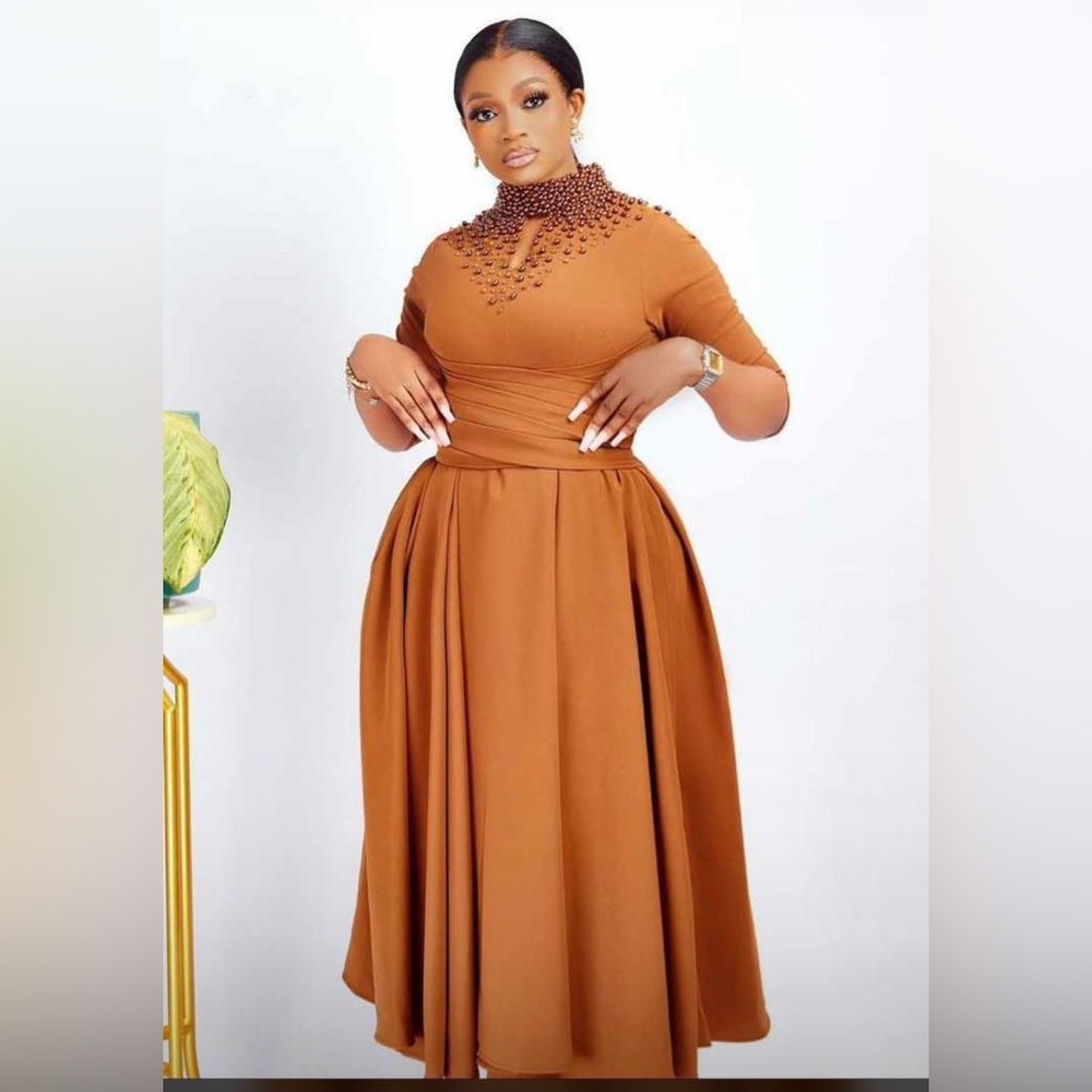 Brown dress embellished with beads